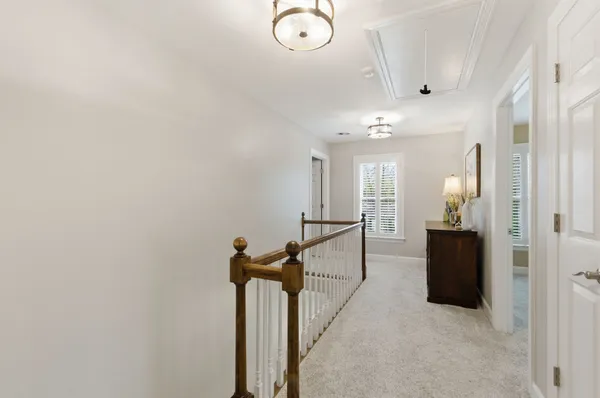 a view of a hallway with windows