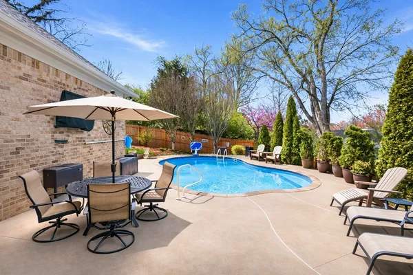 a view of a patio with chairs and tables
