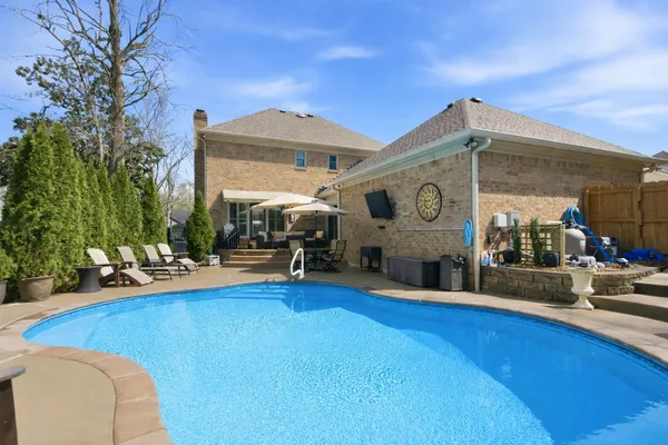 a view of a chairs and table on the patio