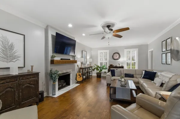 a living room with furniture fireplace and a flat screen tv