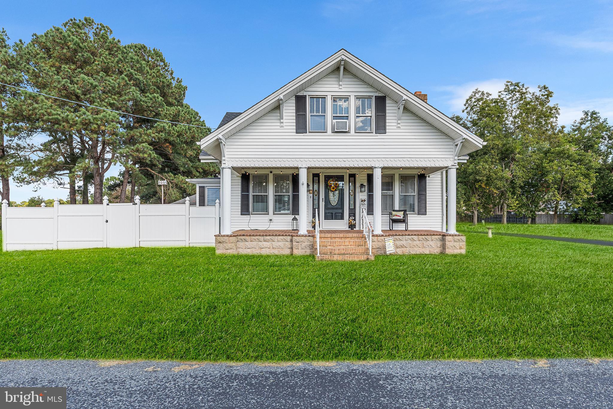 a view of a house with a yard porch and sitting area