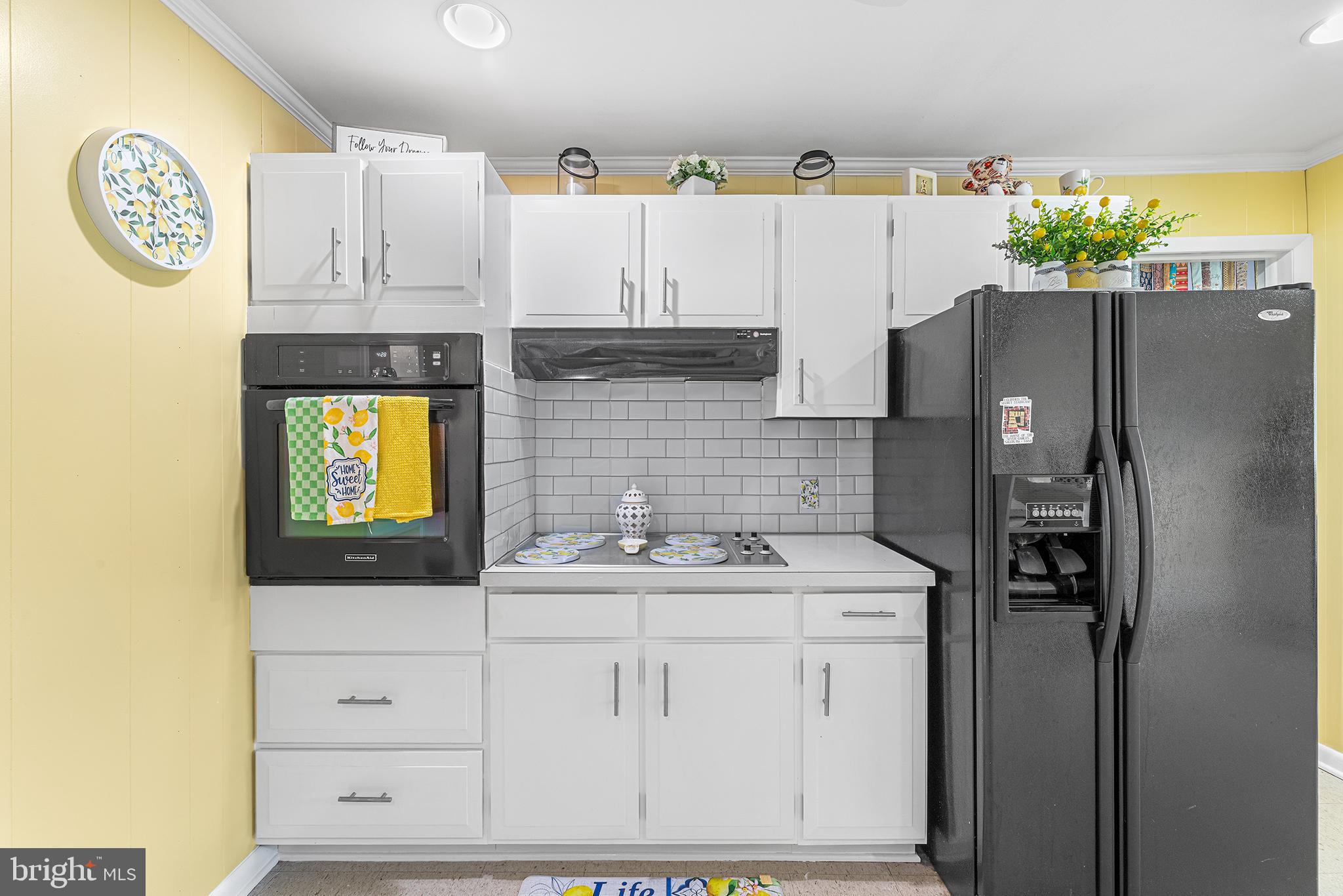 13241 Oyster House Road Princess Anne, MD 21853 - Photo 11 of 39 a kitchen with appliances cabinets and a counter top space
