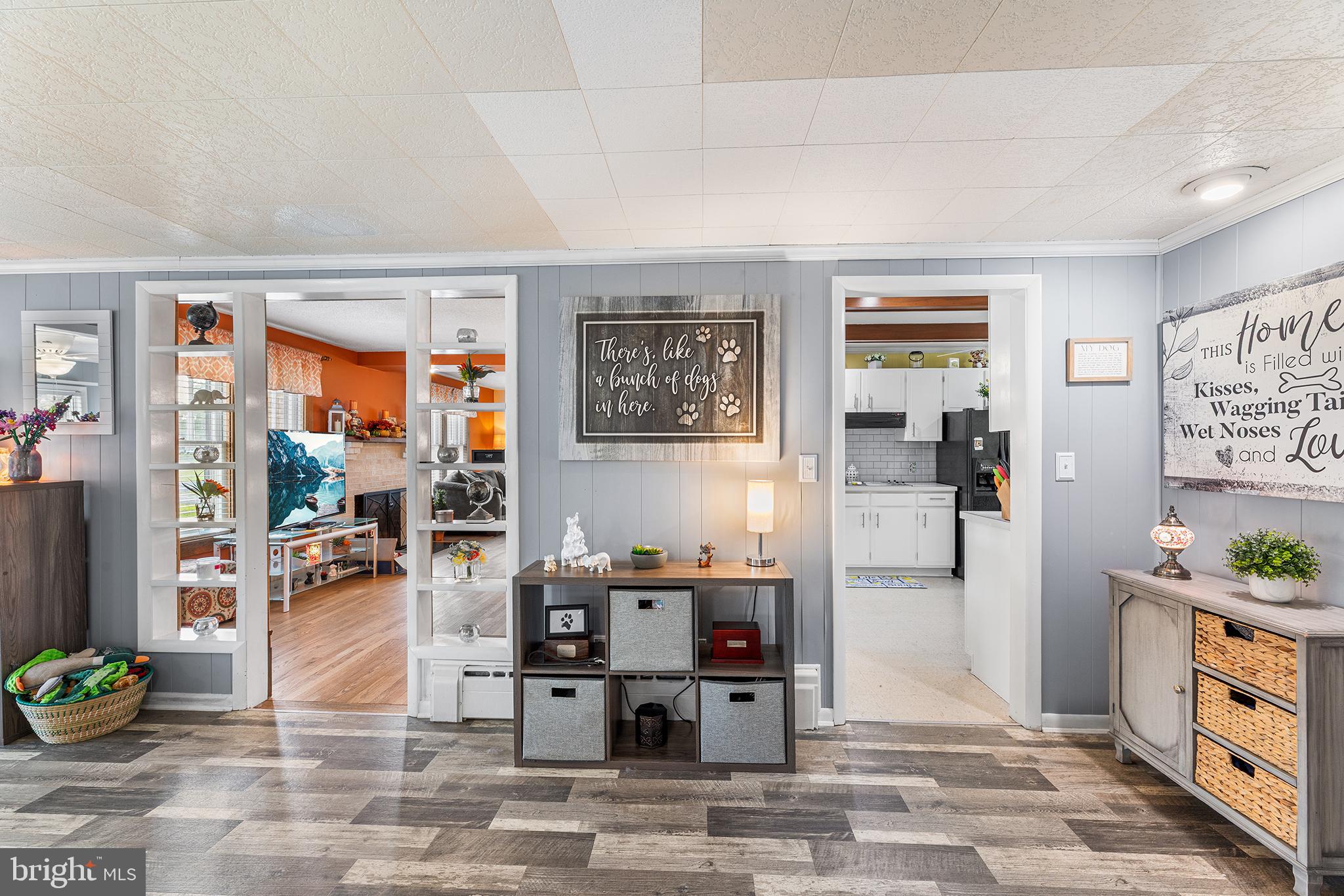 13241 Oyster House Road Princess Anne, MD 21853 - Photo 12 of 39 a living room with furniture a rug and a large window