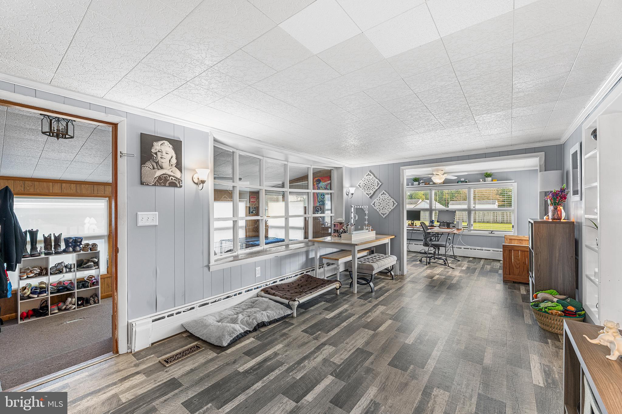 13241 Oyster House Road Princess Anne, MD 21853 - Photo 13 of 39 a living room with furniture and wooden floor