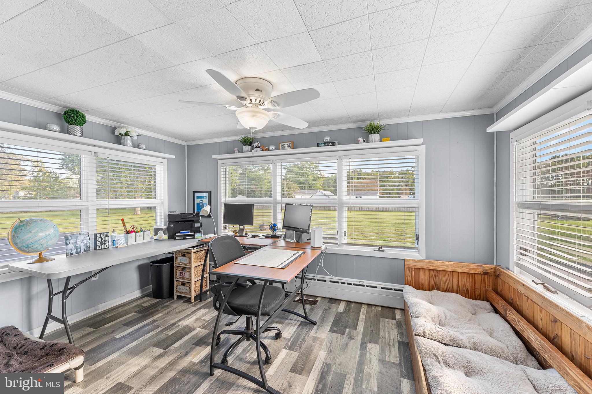 13241 Oyster House Road Princess Anne, MD 21853 - Photo 15 of 39 a living room with furniture and a large window