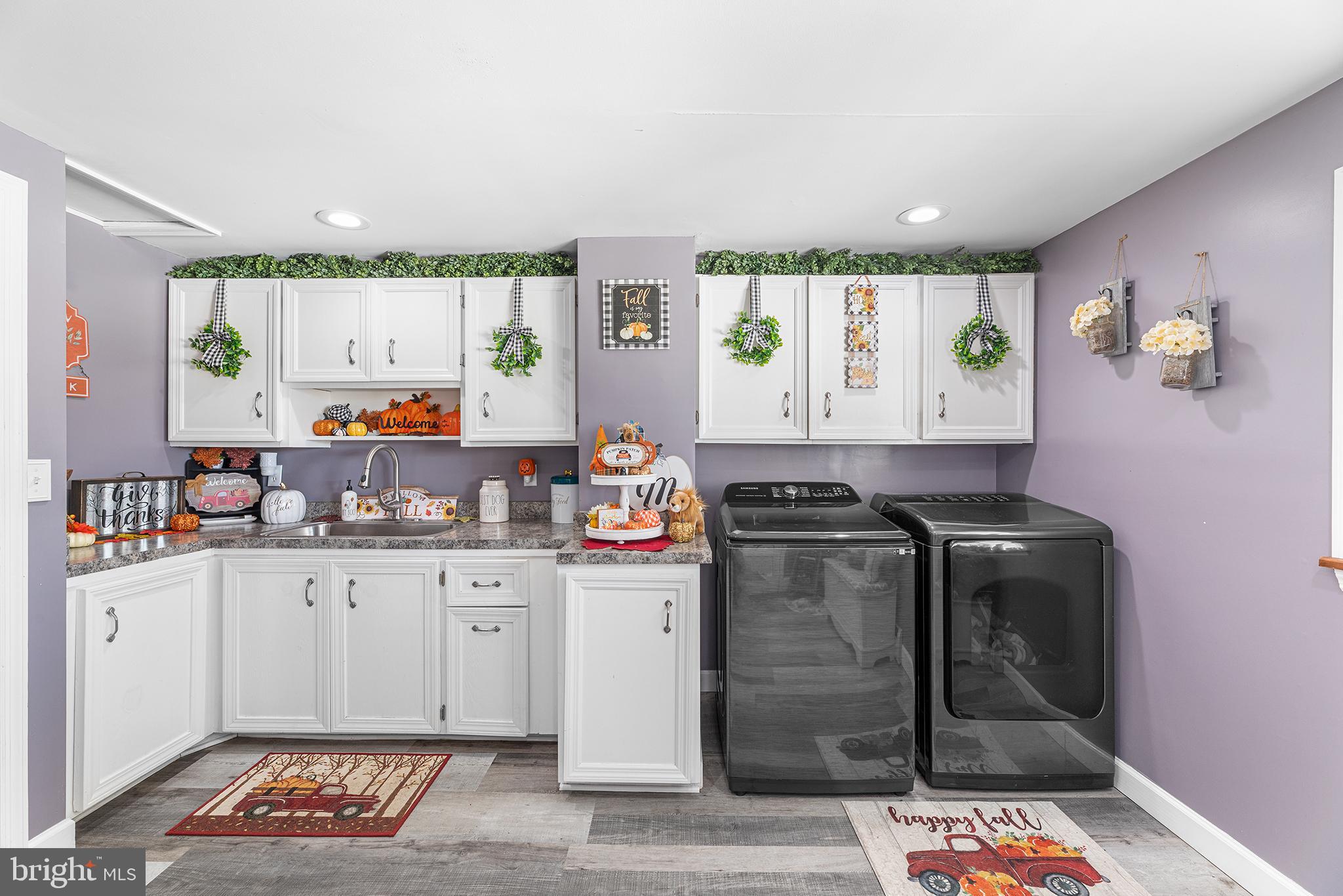 13241 Oyster House Road Princess Anne, MD 21853 - Photo 20 of 39 a kitchen with granite countertop a stove and cabinets