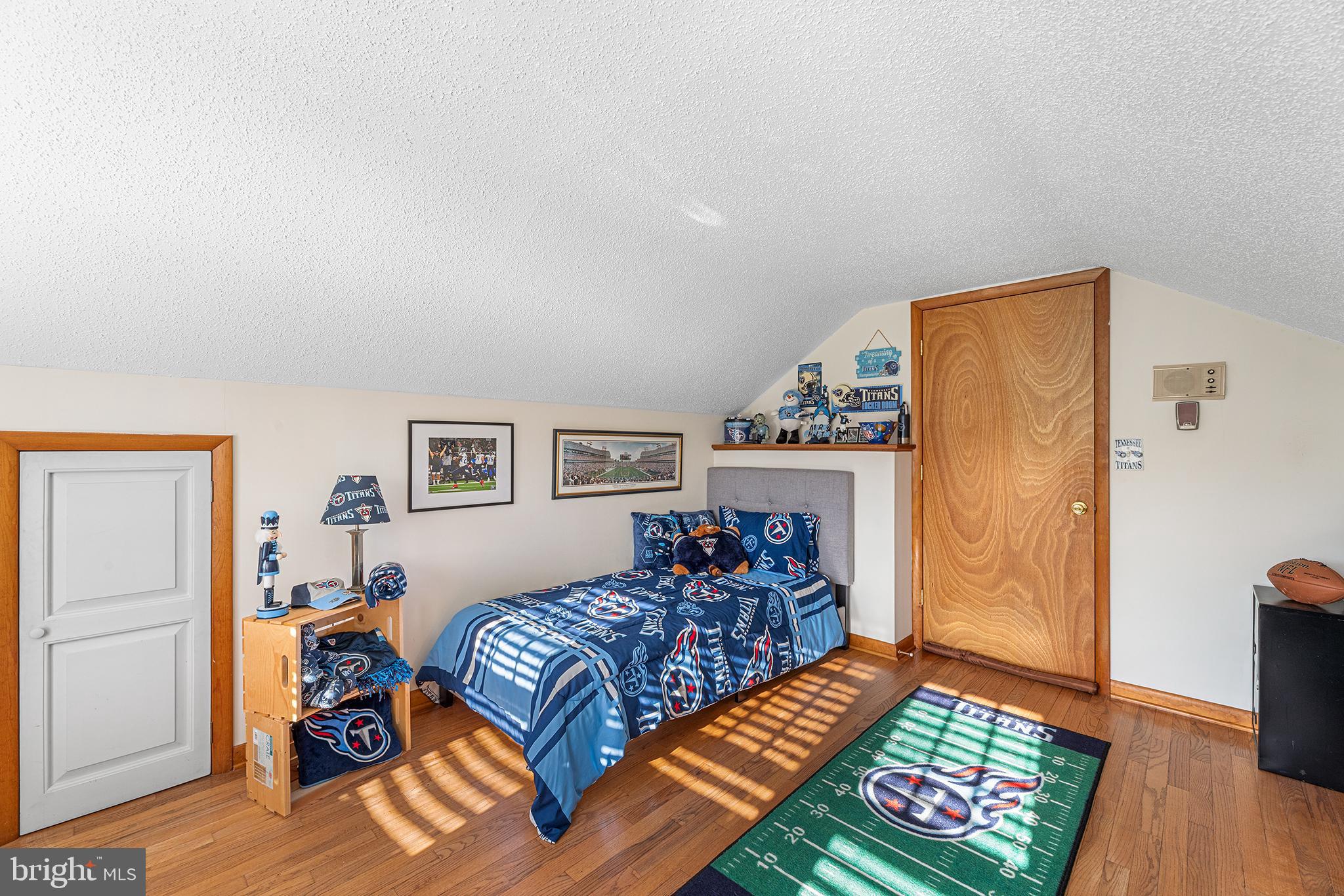 13241 Oyster House Road Princess Anne, MD 21853 - Photo 28 of 39 a bedroom with a bed and wooden floor