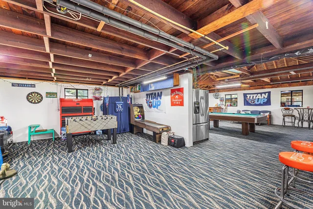 a outdoor space with a large pool table and chairs