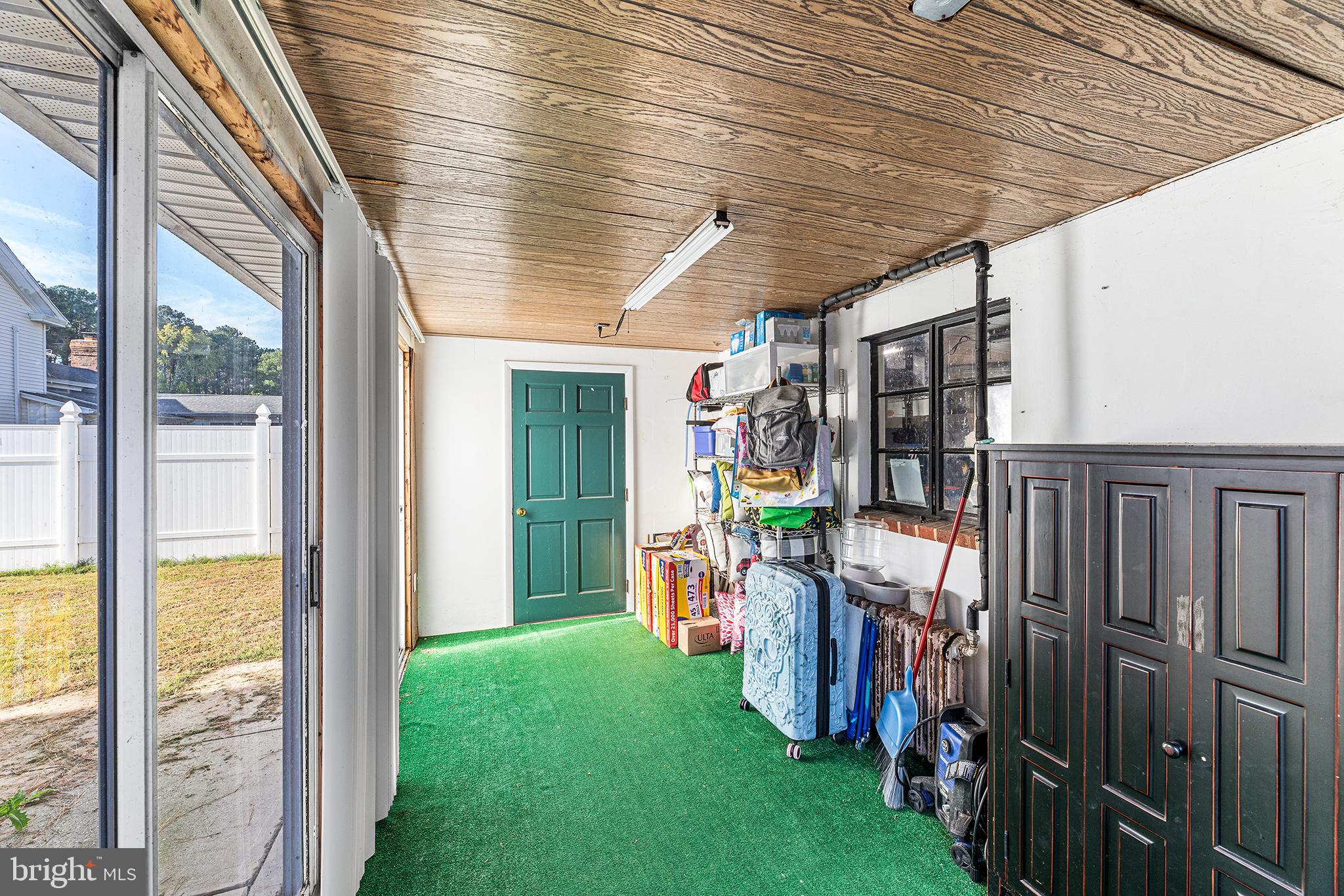 13241 Oyster House Road Princess Anne, MD 21853 - Photo 32 of 39 a view of a porch with wooden floor and outdoor space