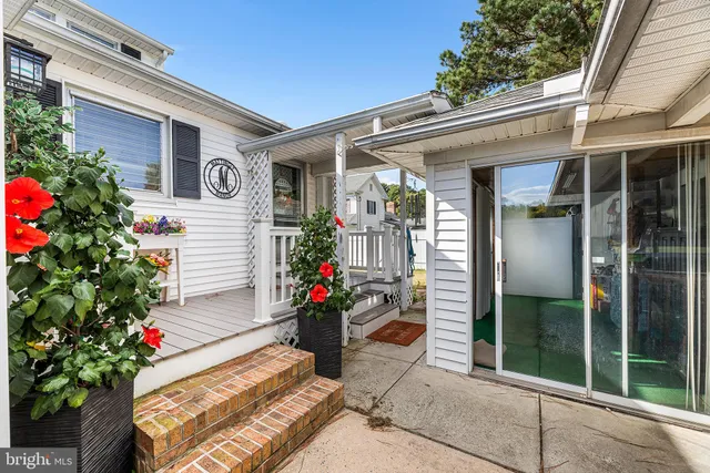 a balcony with furniture and a swing