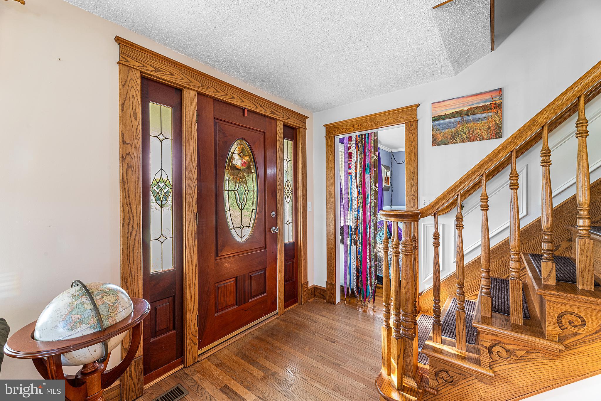 13241 Oyster House Road Princess Anne, MD 21853 - Photo 4 of 39 a view of an entryway with wooden floor and door