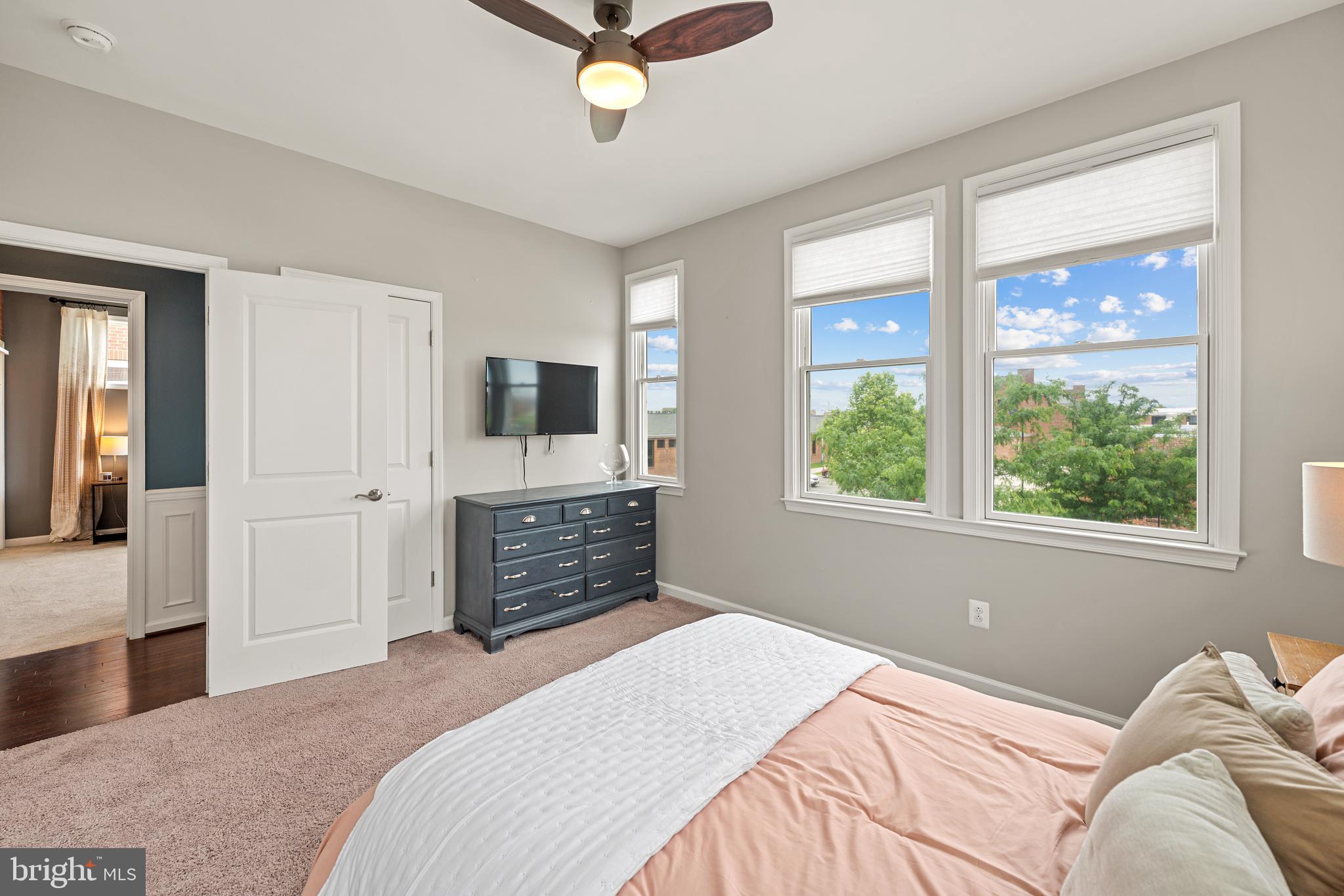 8459 Reformatory Way Lorton, VA 22079 - Photo 42 of 78 a bedroom with a large bed and a window