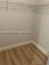 a view of a room with racks on the wall