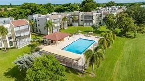 a view of an chairs and table in the garden