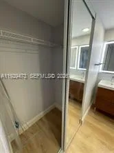 a view of a livingroom with wooden floor