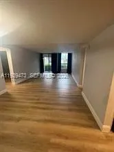 a view of a livingroom with wooden floor