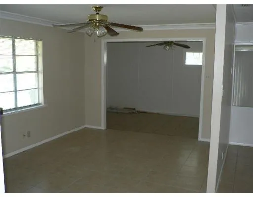 a kitchen with a refrigerator and cabinets