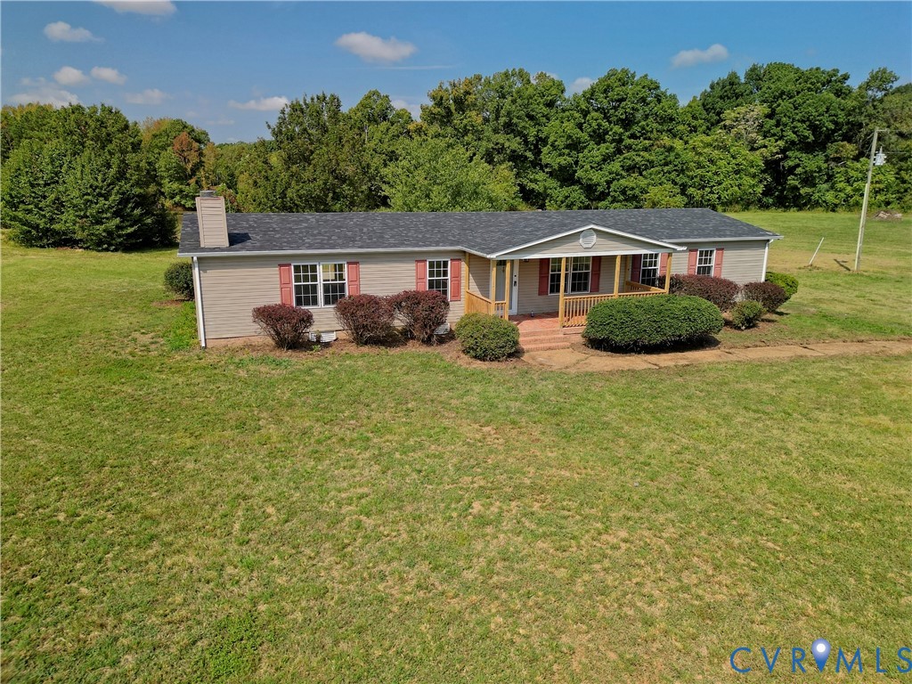 2110 Military Road Amelia Court House, VA 23002 - Photo 2 of 46 a view of a yard in front of a house with large tree