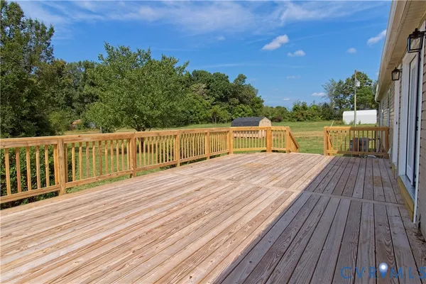 a view of a wooden deck with a bench