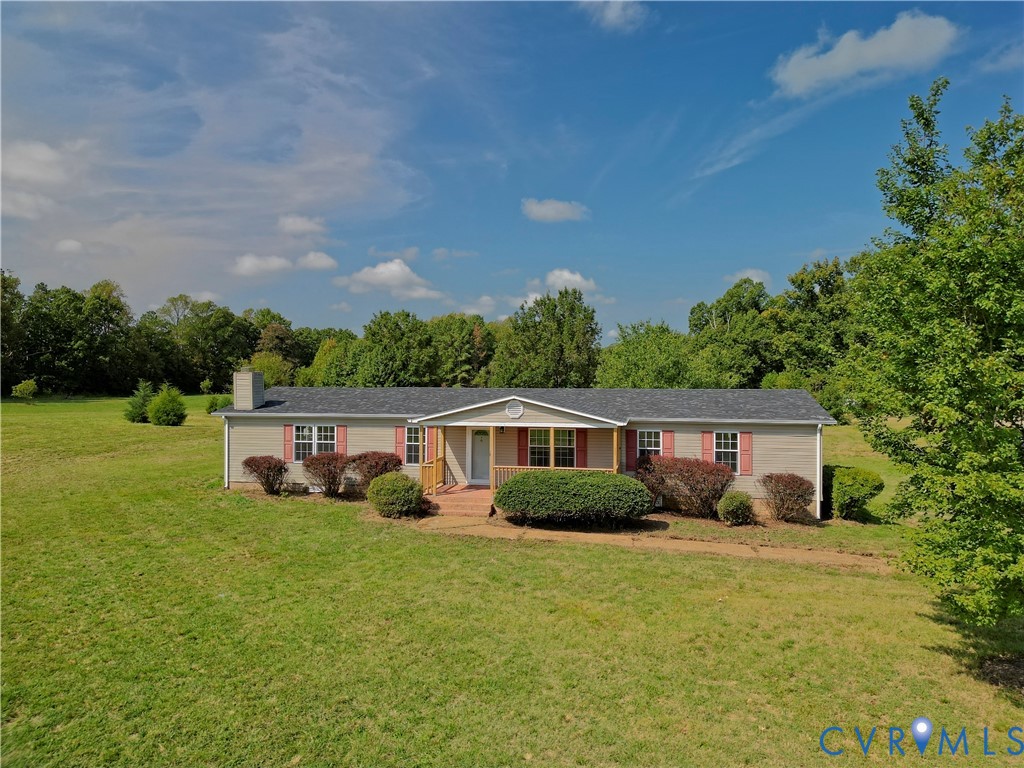 2110 Military Road Amelia Court House, VA 23002 - Photo 3 of 46 a view of a house with a yard and sitting area