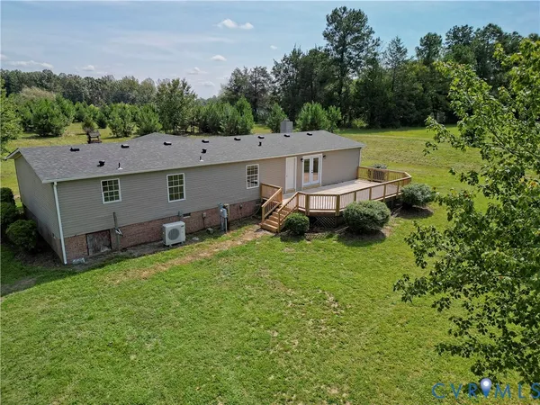 an aerial view of a house with a garden