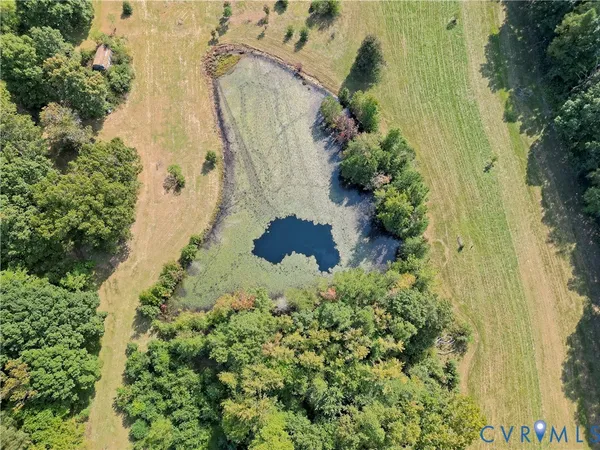an aerial view of residential house with an outdoor space