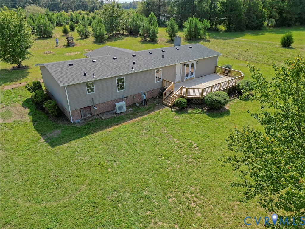 2110 Military Road Amelia Court House, VA 23002 - Photo 5 of 46 an aerial view of a house with garden space and a patio