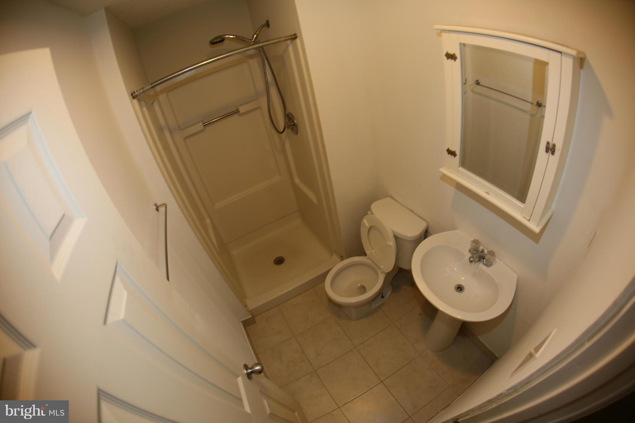 8046 Felecity Court Springfield, VA 22153 - Photo 16 of 26 a bathroom with a toilet sink and mirror