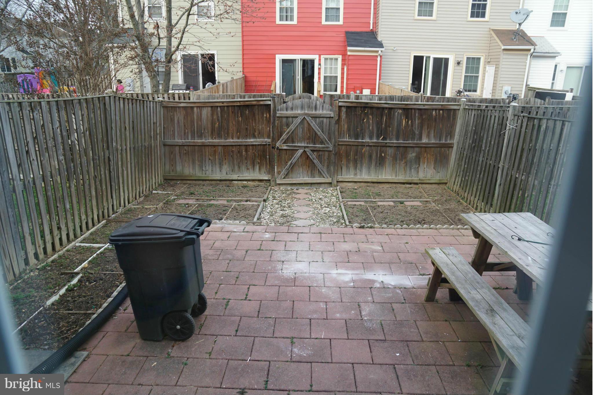 8046 Felecity Court Springfield, VA 22153 - Photo 21 of 26 a view of a buildings with wooden fence