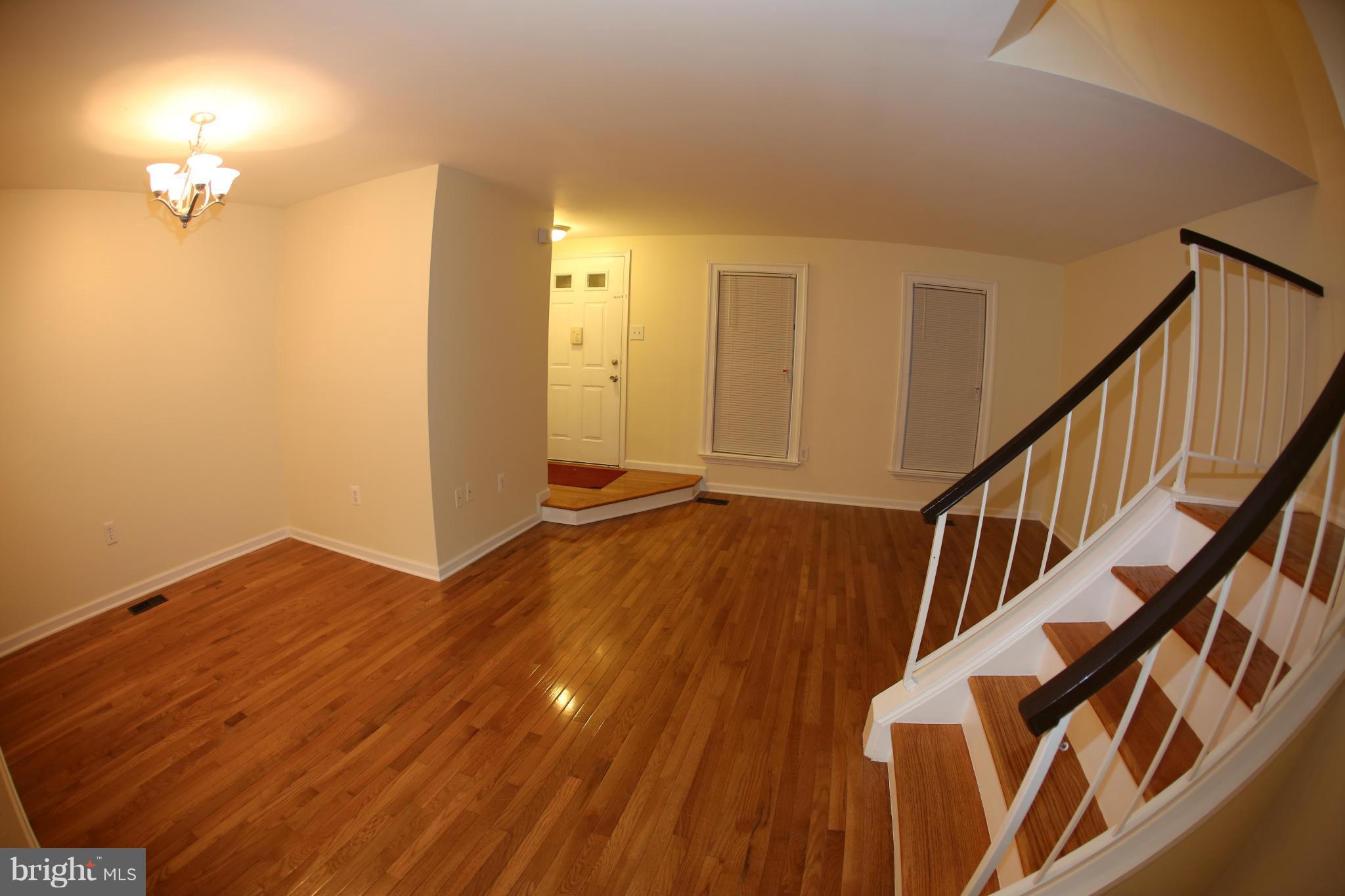 8046 Felecity Court Springfield, VA 22153 - Photo 4 of 26 a view of an entryway with wooden floor