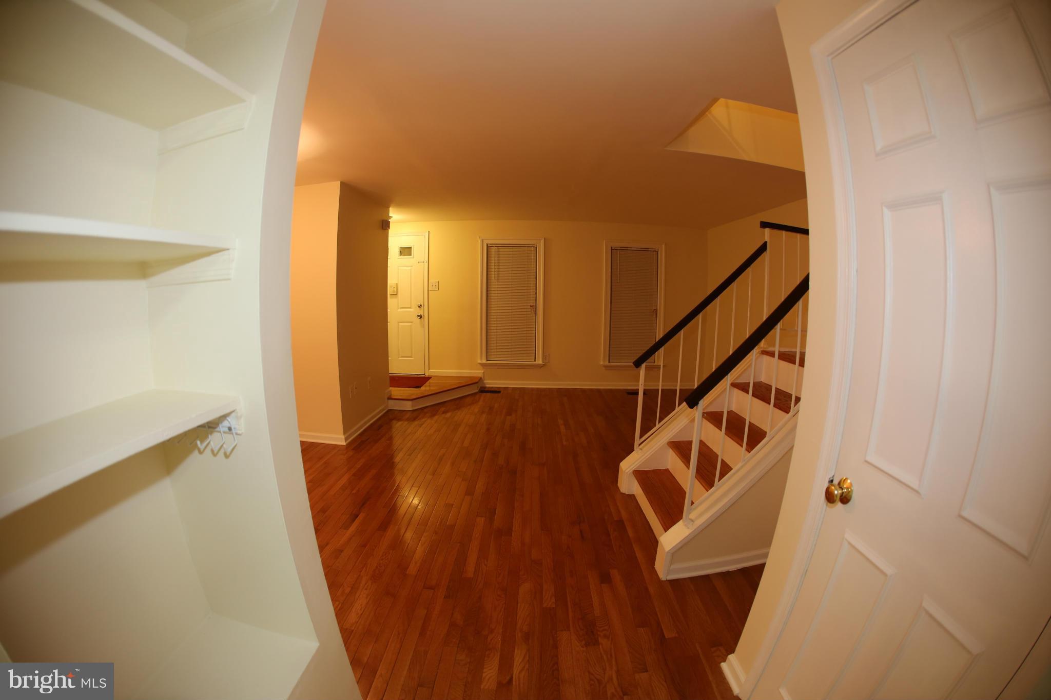8046 Felecity Court Springfield, VA 22153 - Photo 10 of 26 a view of entryway with wooden floor