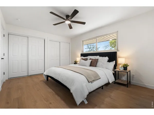 a bathroom with a granite countertop sink a toilet and a bathtub