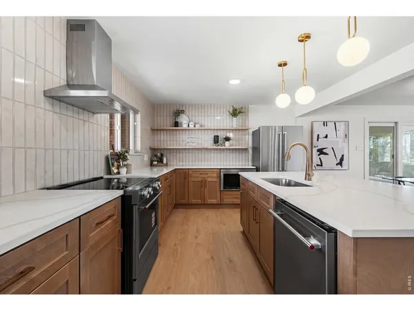 a kitchen with a table chairs and a window