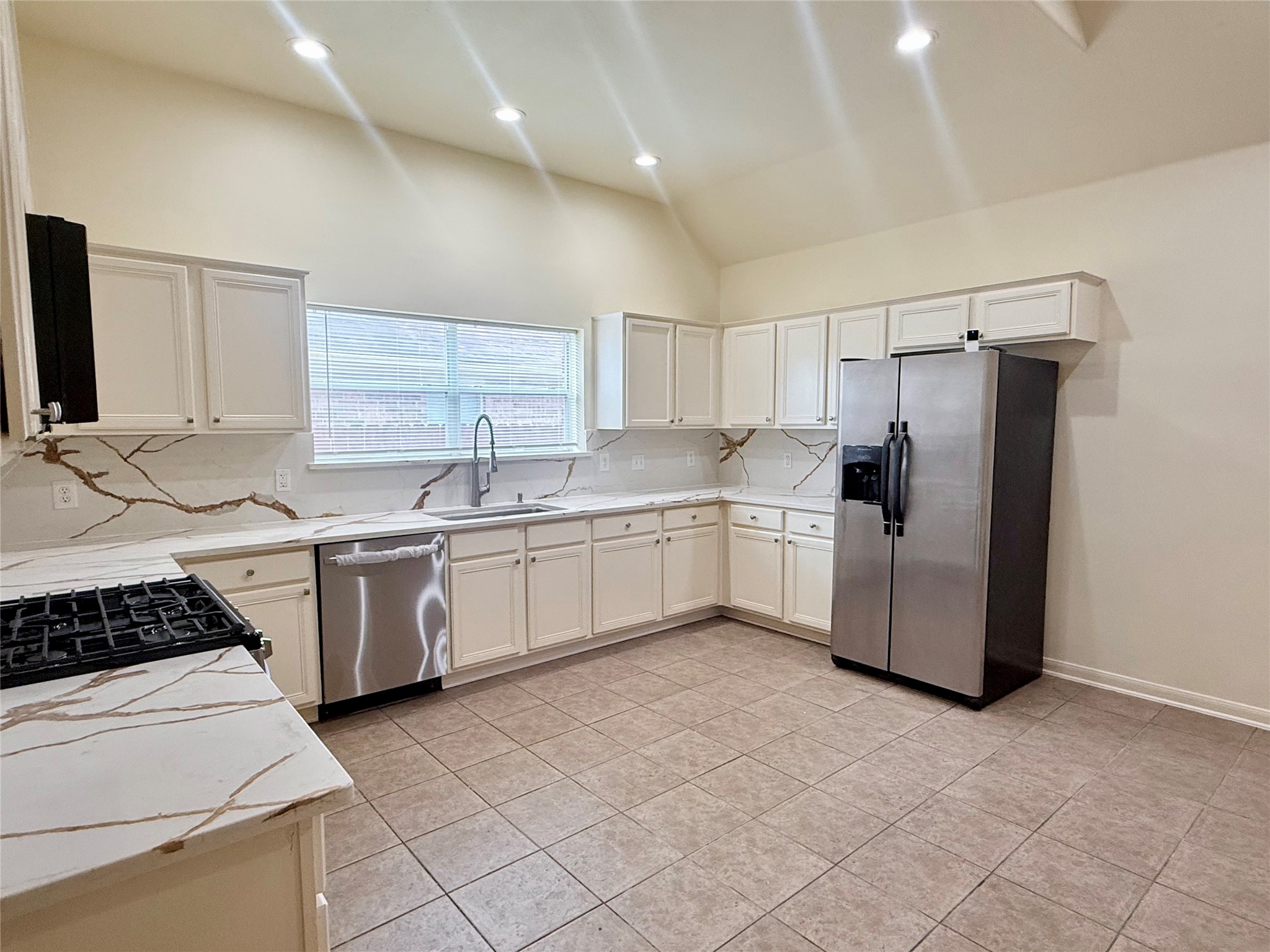 6530 Signal Point Lane Houston, TX 77064 - Photo 12 of 28 Kitchen with granite countertop and stainless steel appliances