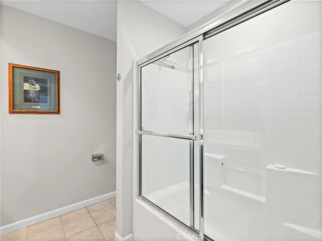 a bathroom with a glass shower door