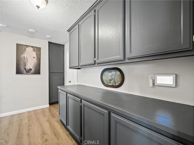a view of cabinets with wooden floor
