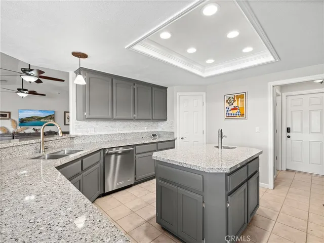 a kitchen with a sink and a stove top oven with wooden floor