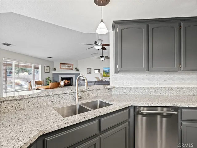 a kitchen with a sink and a refrigerator