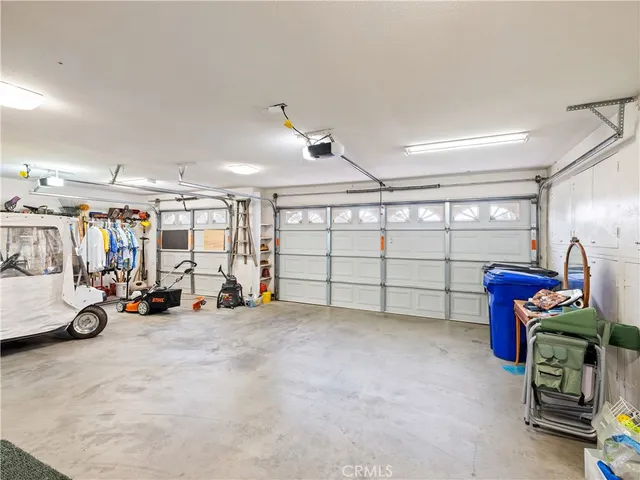 a view of a garage with rack and bicycle