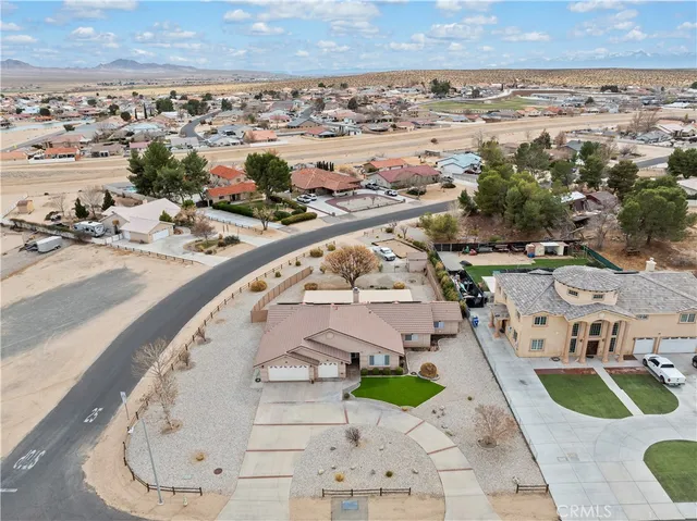 an aerial view of a house with a swimming pool