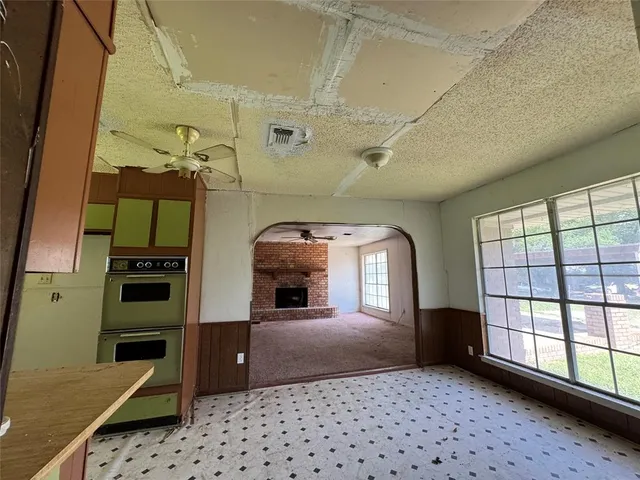 a view of a hallway with windows