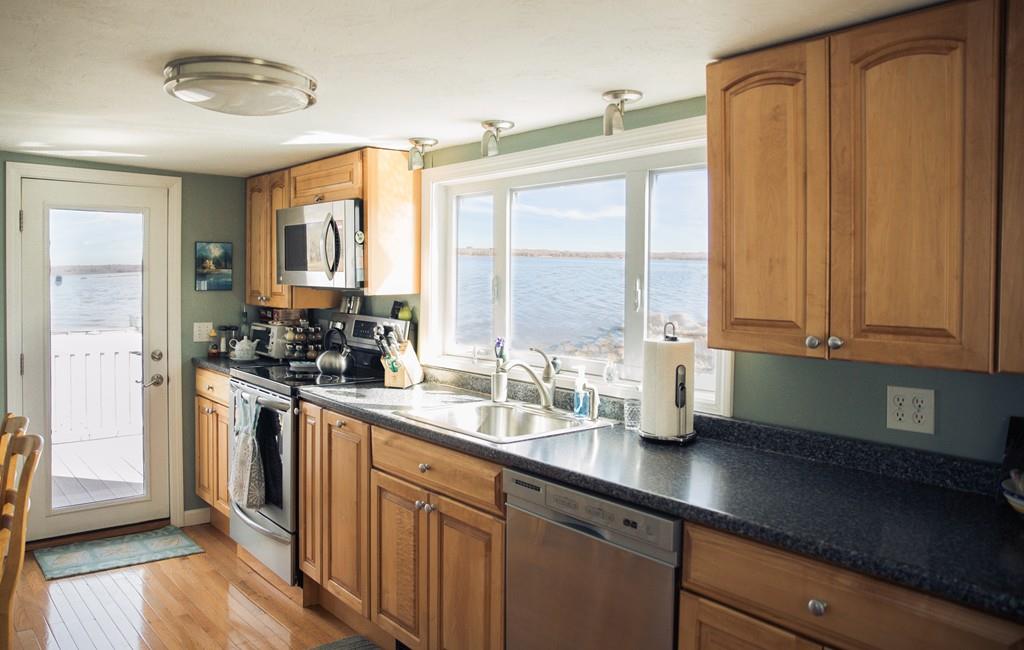 166 River Road Westport, MA 02790 - Photo 14 of 30 a kitchen with stainless steel appliances granite countertop a sink a stove and a window