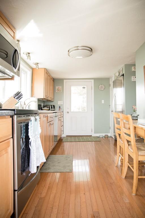 166 River Road Westport, MA 02790 - Photo 15 of 30 a view of a kitchen with wooden floor and electronic appliances