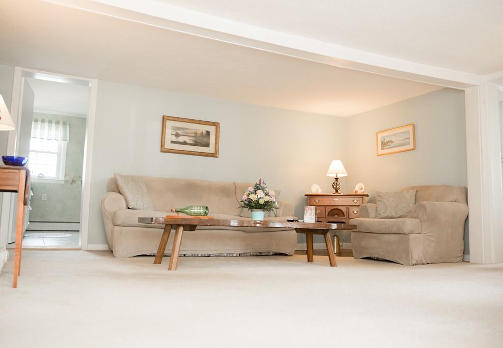 166 River Road Westport, MA 02790 - Photo 16 of 30 a living room with furniture and a lamp