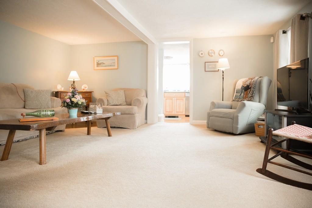 166 River Road Westport, MA 02790 - Photo 18 of 30 a living room with furniture and a flat screen tv