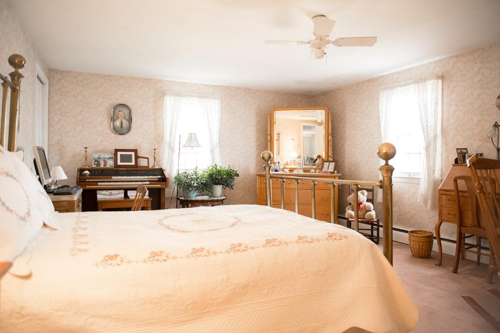 166 River Road Westport, MA 02790 - Photo 20 of 30 a bedroom with a bed and dresser with mirror