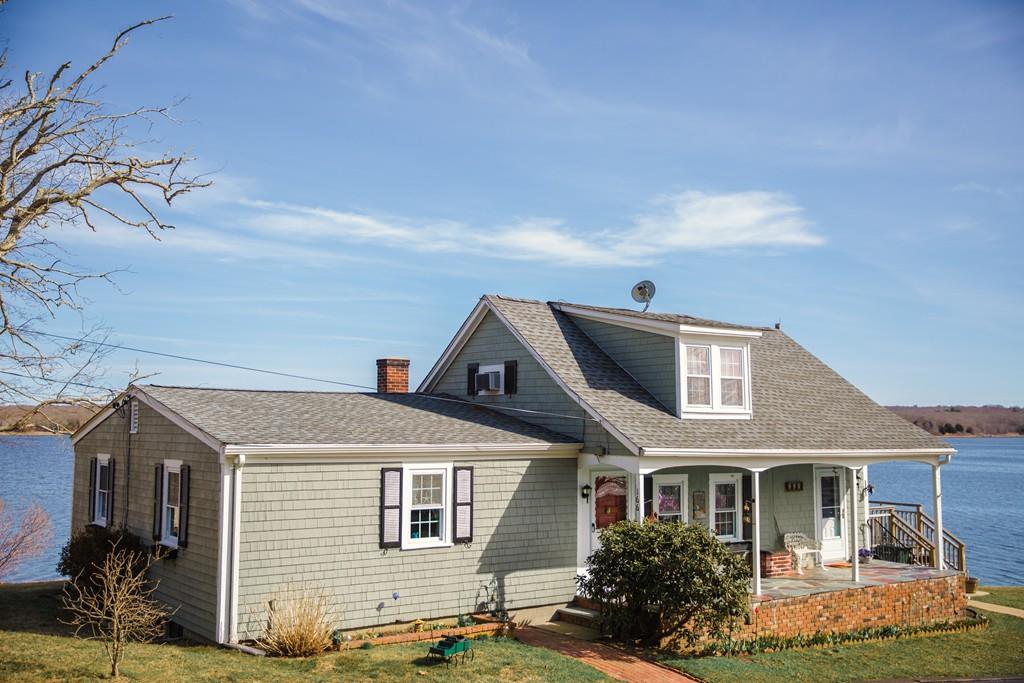 166 River Road Westport, MA 02790 - Photo 2 of 30 a front view of a house with garden