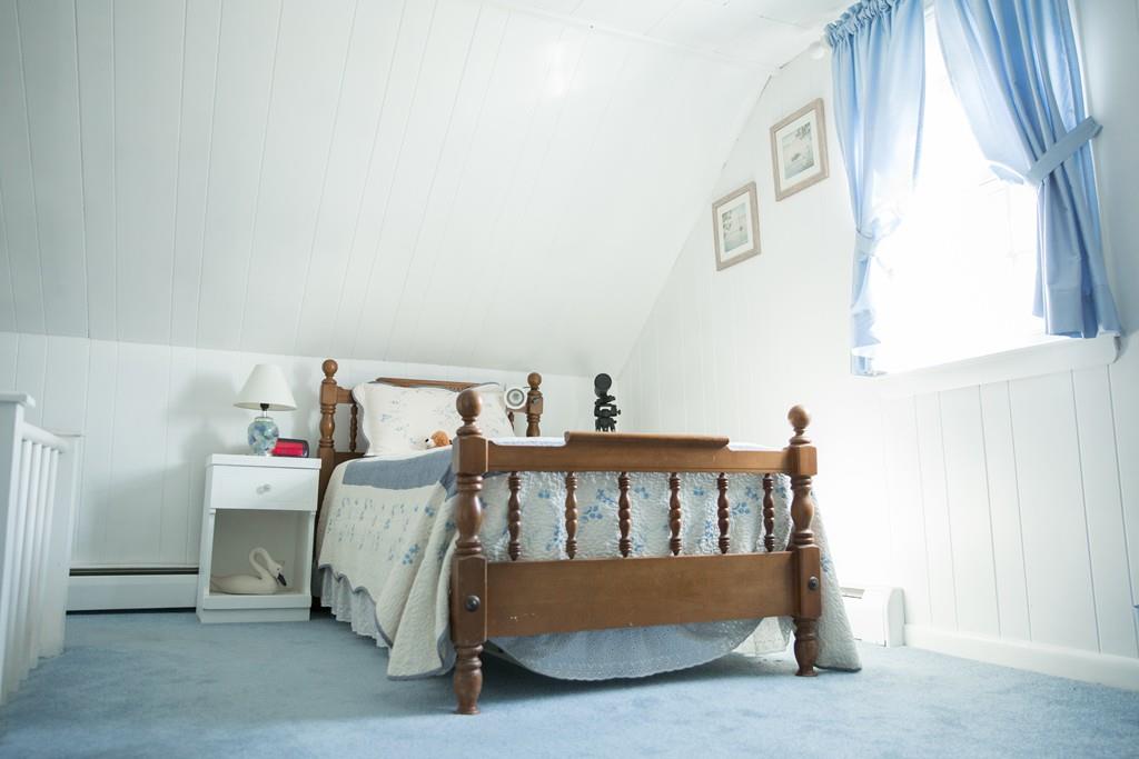 166 River Road Westport, MA 02790 - Photo 21 of 30 a bedroom with furniture and a window