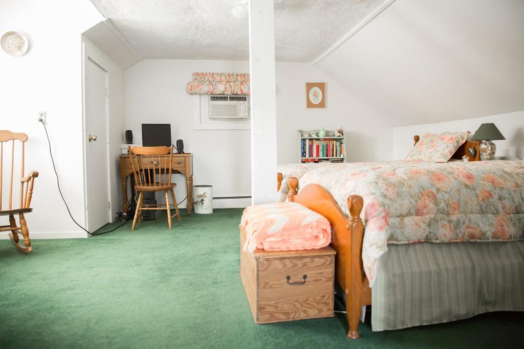 166 River Road Westport, MA 02790 - Photo 23 of 30 a bed room with a bed and a chair