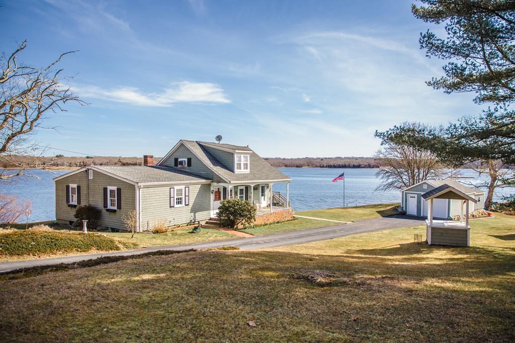 166 River Road Westport, MA 02790 - Photo 3 of 30 a front view of a house with a yard